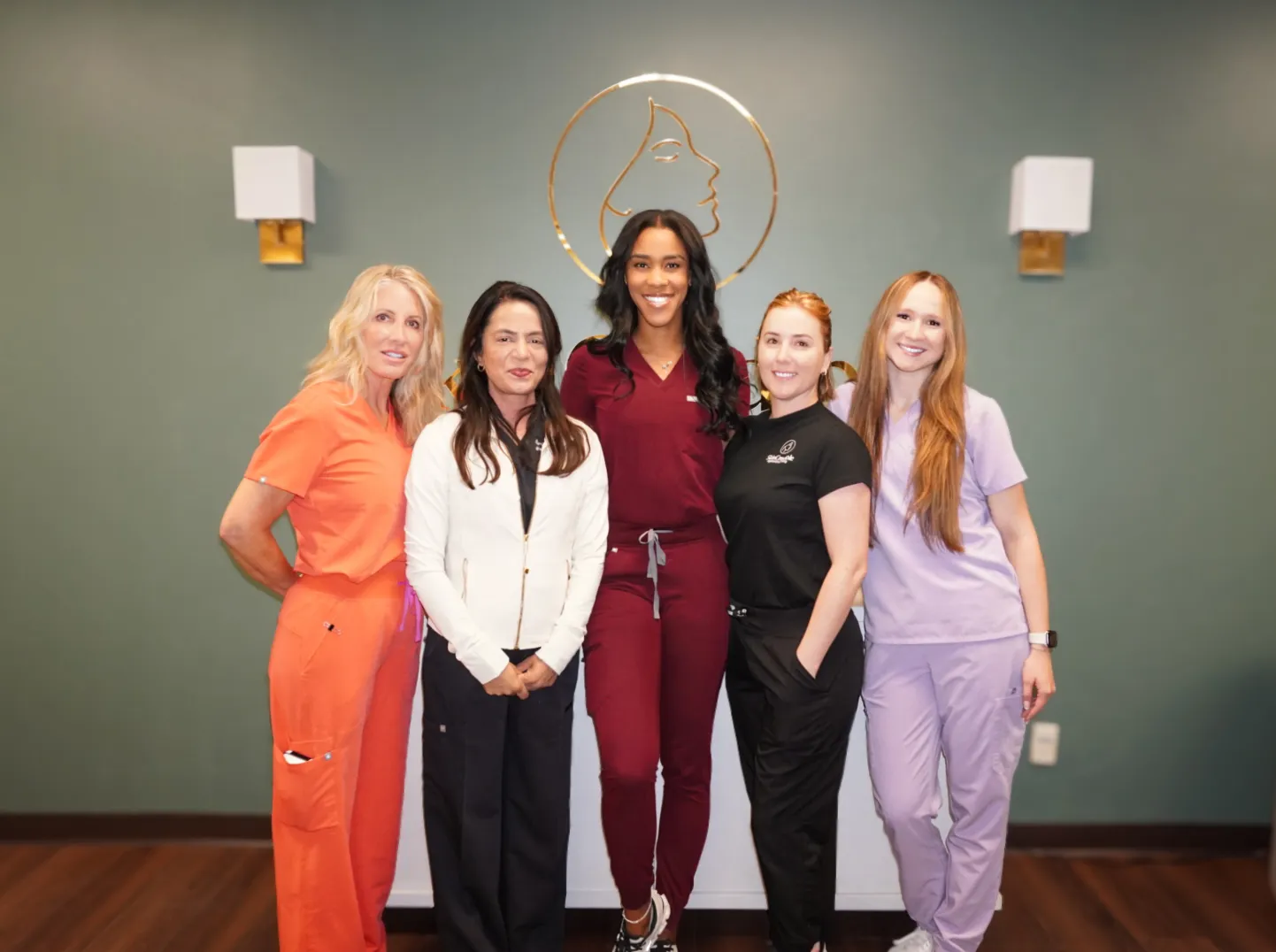 Kimberly Phillips, Dr. Samrah Mansoor, Faith Davis, and Brylie Laake of Skincredible at their North Rock Road clinic in Wichita